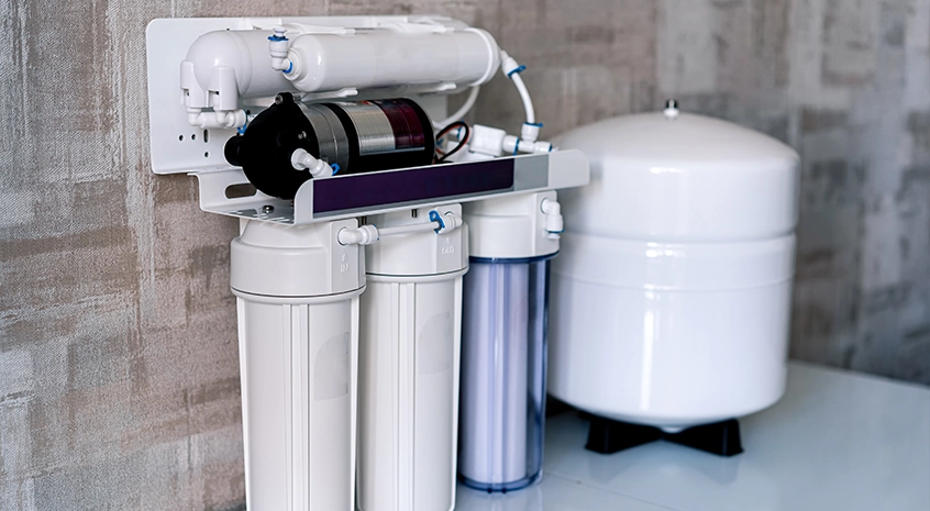 Water filtration system with multiple filters and a storage tank.