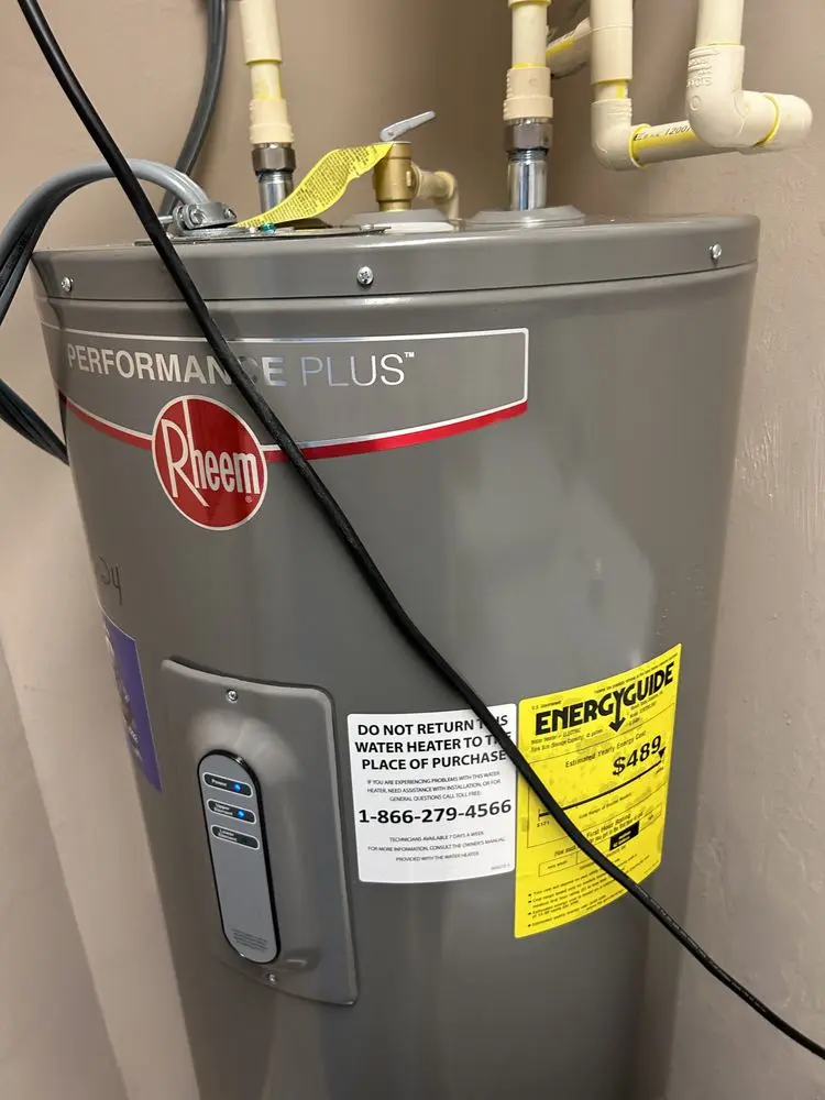 Water heater with control panel and energy efficiency label.